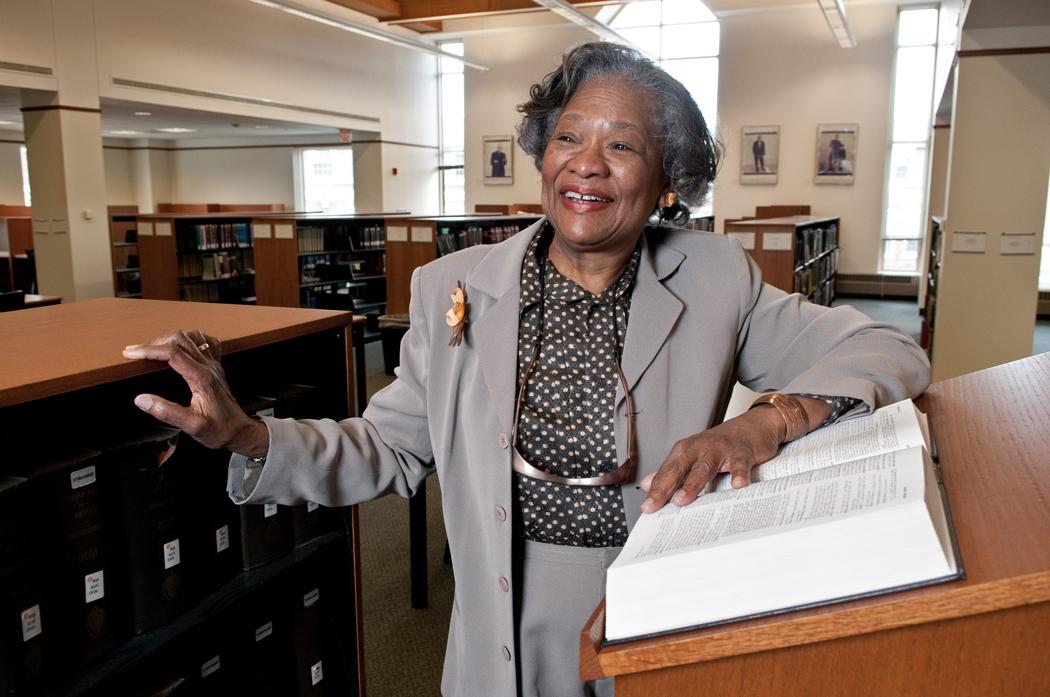 A Black woman in a library